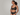 mobile alternative for Woman wearing a black bra against a gray background
