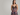 mobile alternative for Woman wearing a floral dress with a lace bodice on a plain background