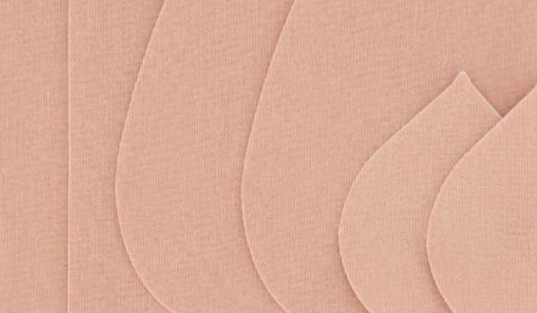 Close up shot of the texture of boob tape and strapless tape