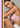 mobile alternative for Woman wearing a pink bra against a gray background