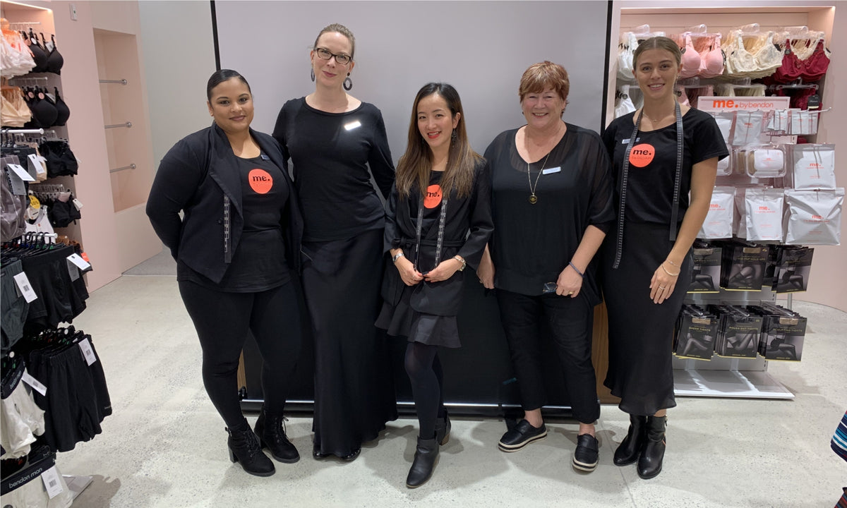 Bendon Lingerie team ready to help you in store, posing against a store counter in store
