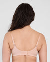 Model wears Power Underwire Bra in LATTE. On body back view