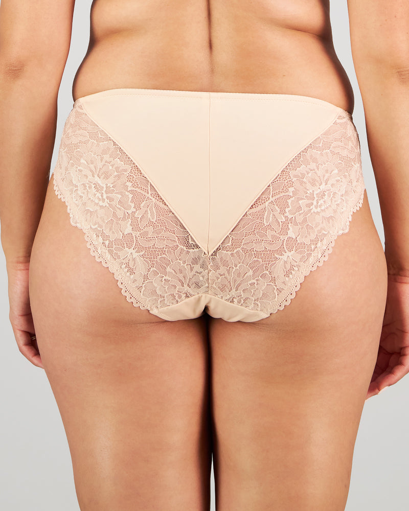 Model wears Laurel High Cut Brief in LATTE. On body back view