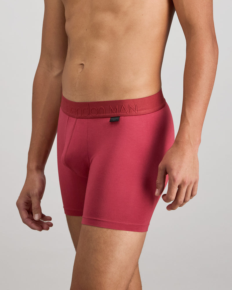 Model wears Bamboo Mens Trunk in GARNET. On body side view