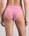 Model wears Lightweight High Cut Brief in BUBBLEGUM PINK. On body back view