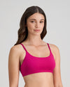 Model wears Extra-Ordinary Crop Top in FANTASY FUCHSIA. On body side view