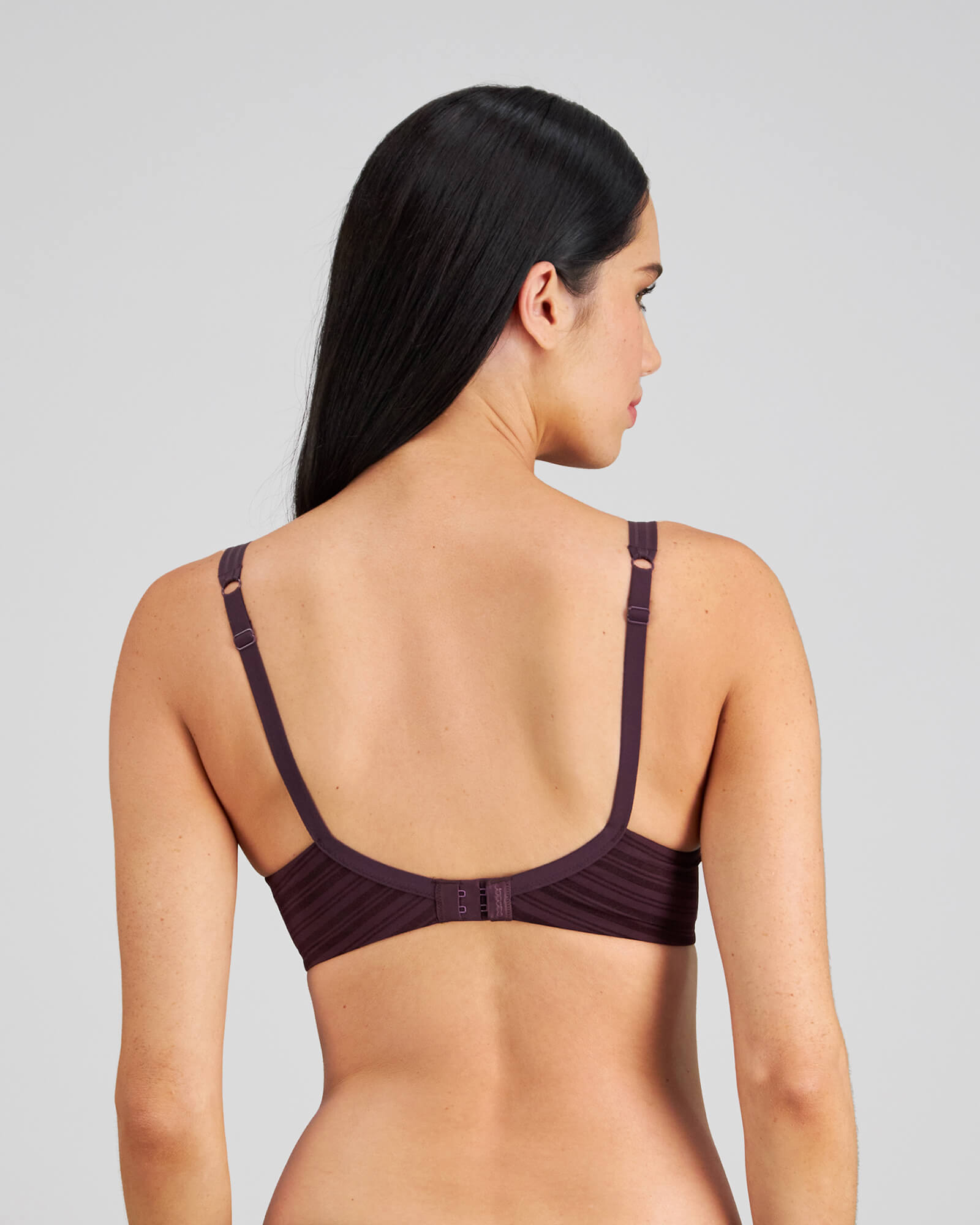 Model wears Rita Contour Bra in PLUM PERFECT. On body back view