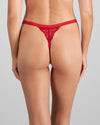 Model wears Lace Me Up Thong in JESTER RED. On body back view