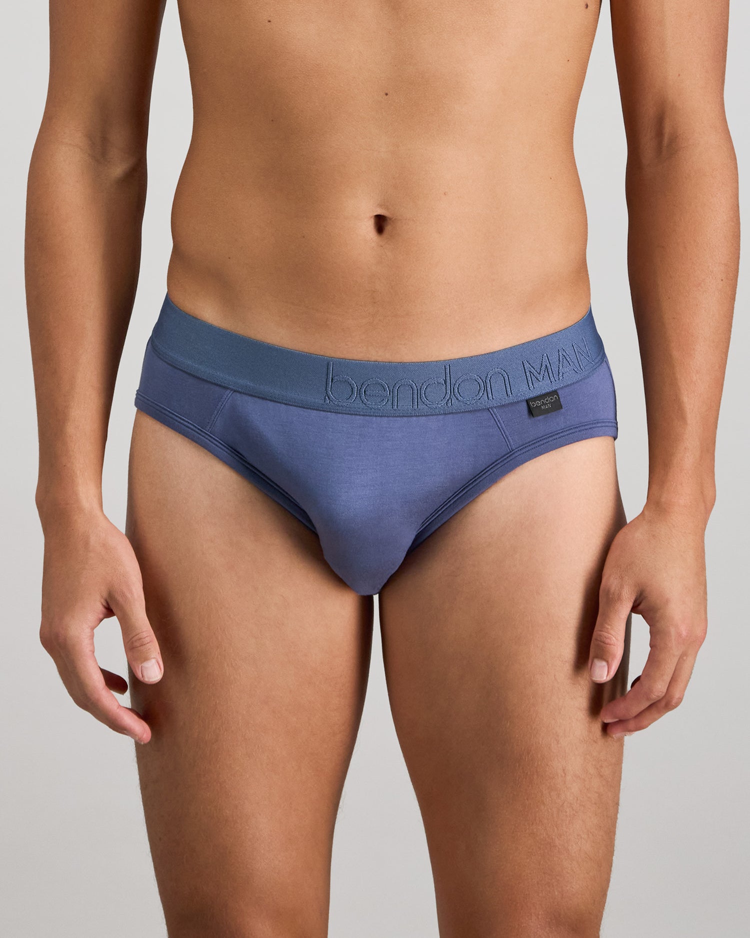 Model wears Bamboo Mens Brief in VINTAGE INDIGO. On body front view
