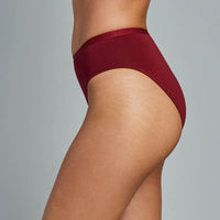 Model wears Body Cotton High Cut Brief in RHUBARB. On body side view