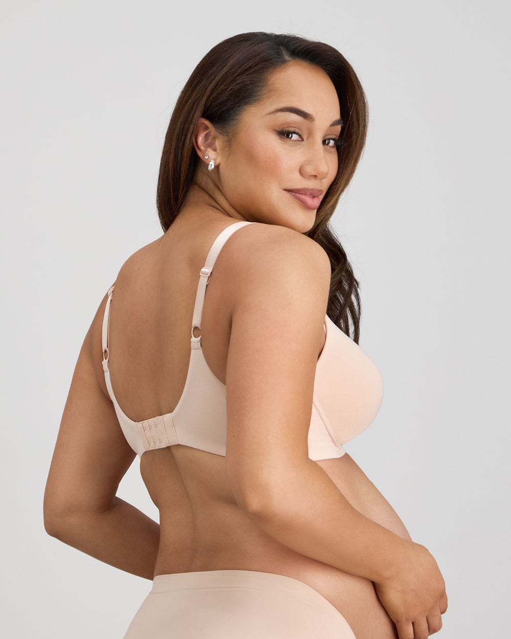 Model wears Bendon Nurture Maternity Bra in LATTE. On body back view