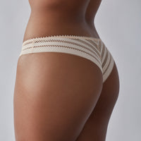 Model wears Morning Lola Thong in SCALLOP SHELL. On body back view