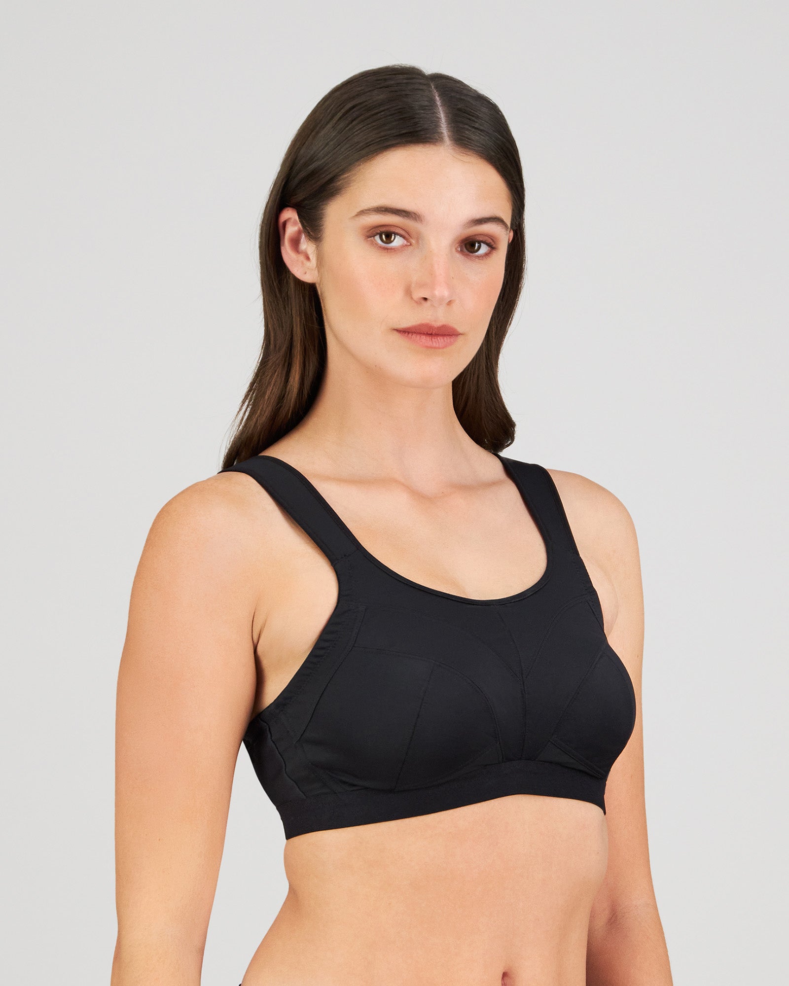 Model wears Stamina Wire Free Bra in BLACK. On body side view
