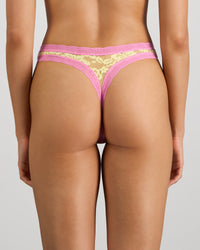 Model wears Leo Thong in LEMON/FUCHSIA PINK. On body back view
