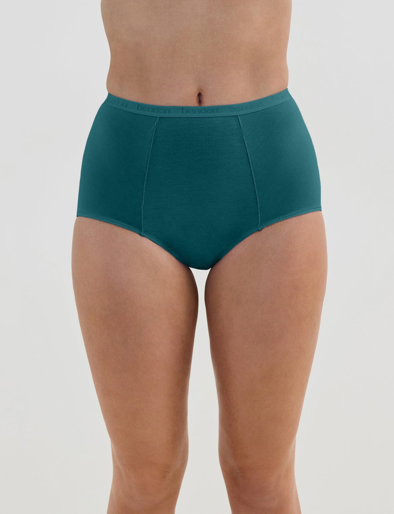 Model wears Body Cotton Full Brief in RAIN FOREST. On body front view
