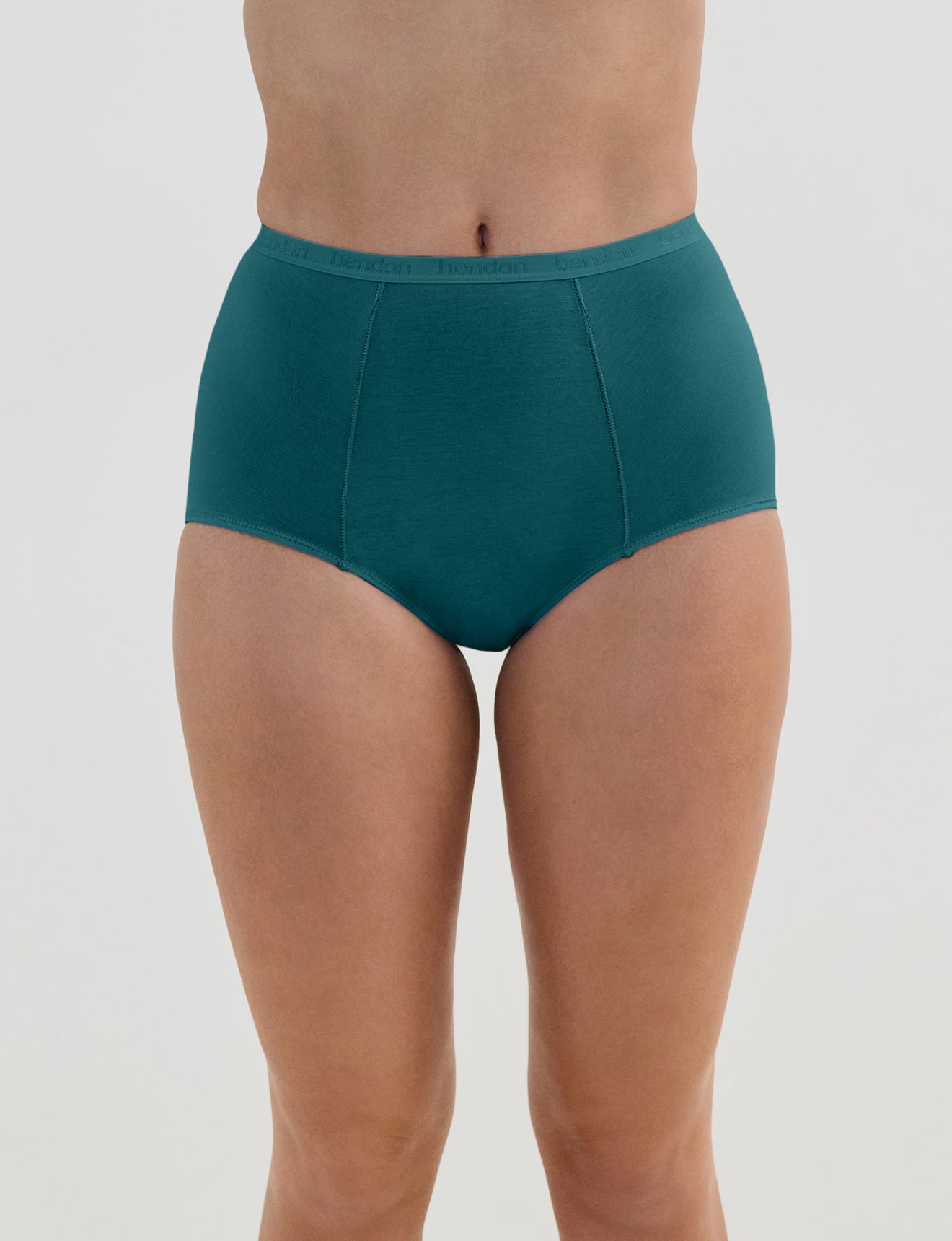 Model wears Body Cotton Full Brief in RAIN FOREST. On body front view