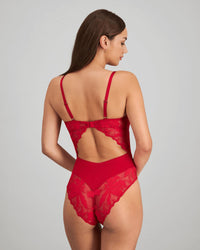 Model wears Margot Estelle Bodysuit in JESTER RED. On body side view