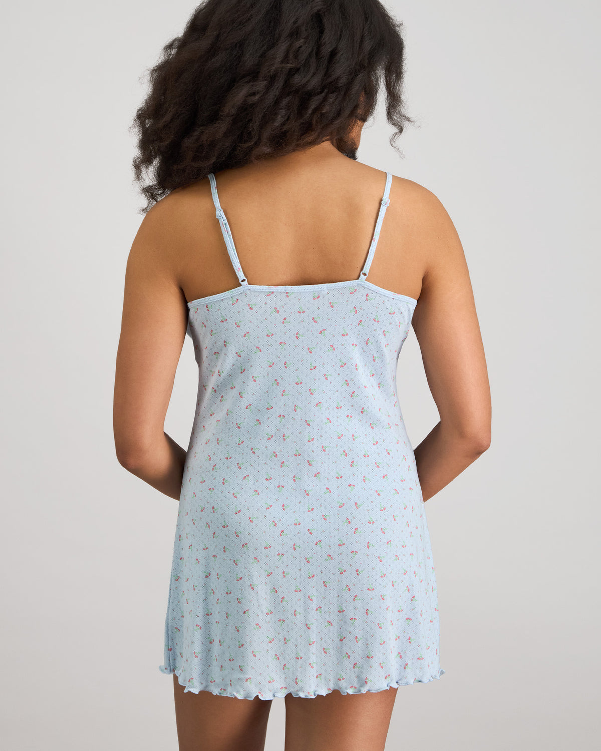 Model wears Smoothie Chemise in SKYWAY. On body back view
