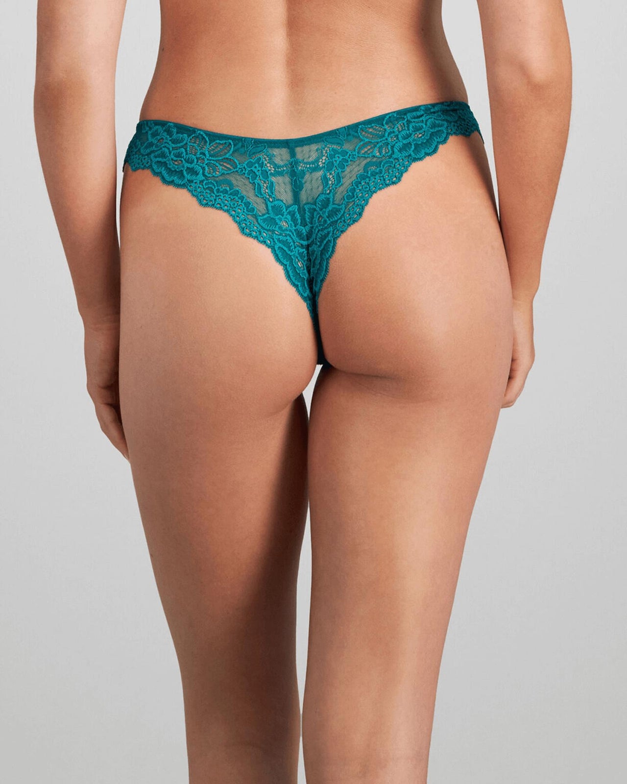 Model wears My Fit Lace Thong in EVERGLADE. On body back view