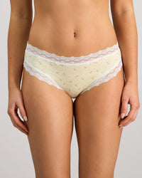 Model wears Daily Micro Bikini in TRANSPARENT YELLOW. On body front view