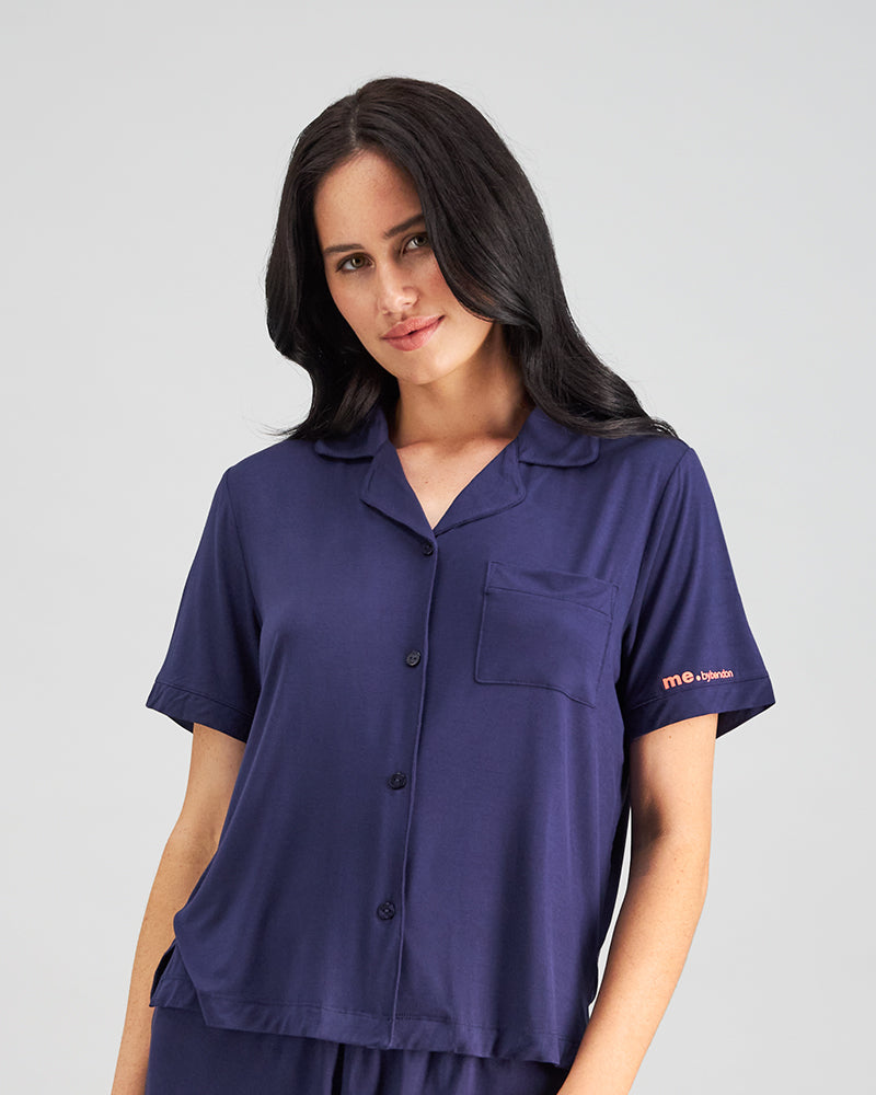 Model wears Belle Bamboo Short PJ in EVENING BLUE. On body front view