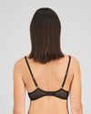 Model wears Sheer Impact Underwire Bra in BLACK. On body back view