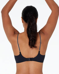 Model wears Naturally Me Contour Bra in BLACK. On body back view