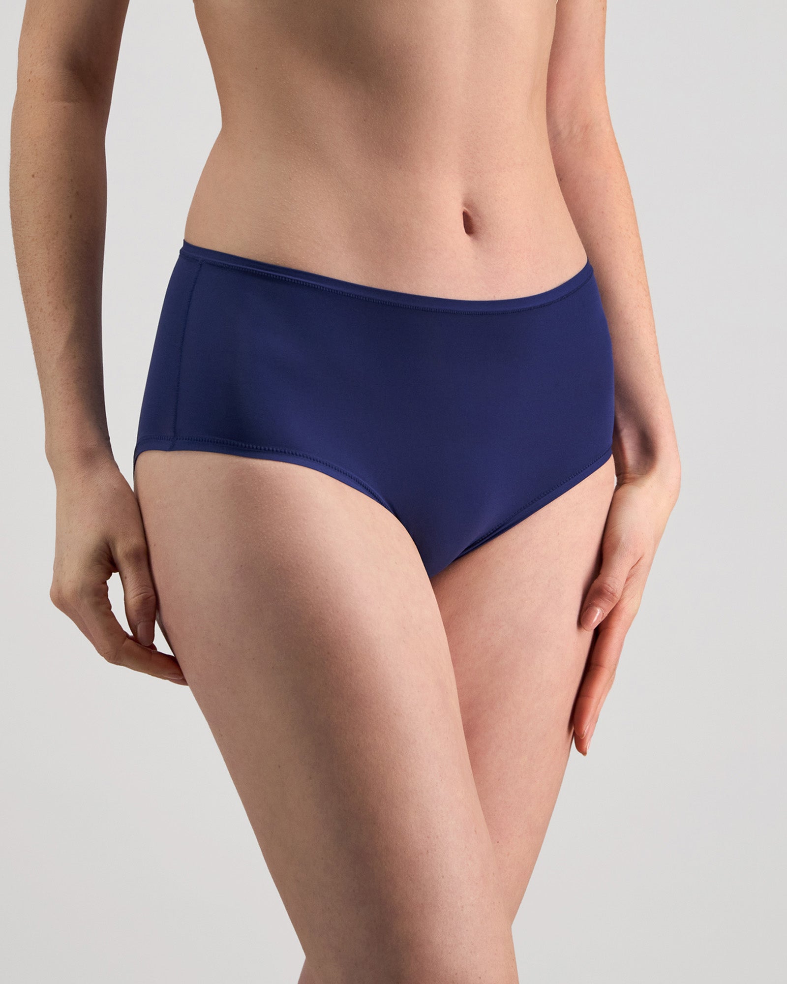 Model wears Extra-Ordinary Full Brief in Medieval Blue. On body side view