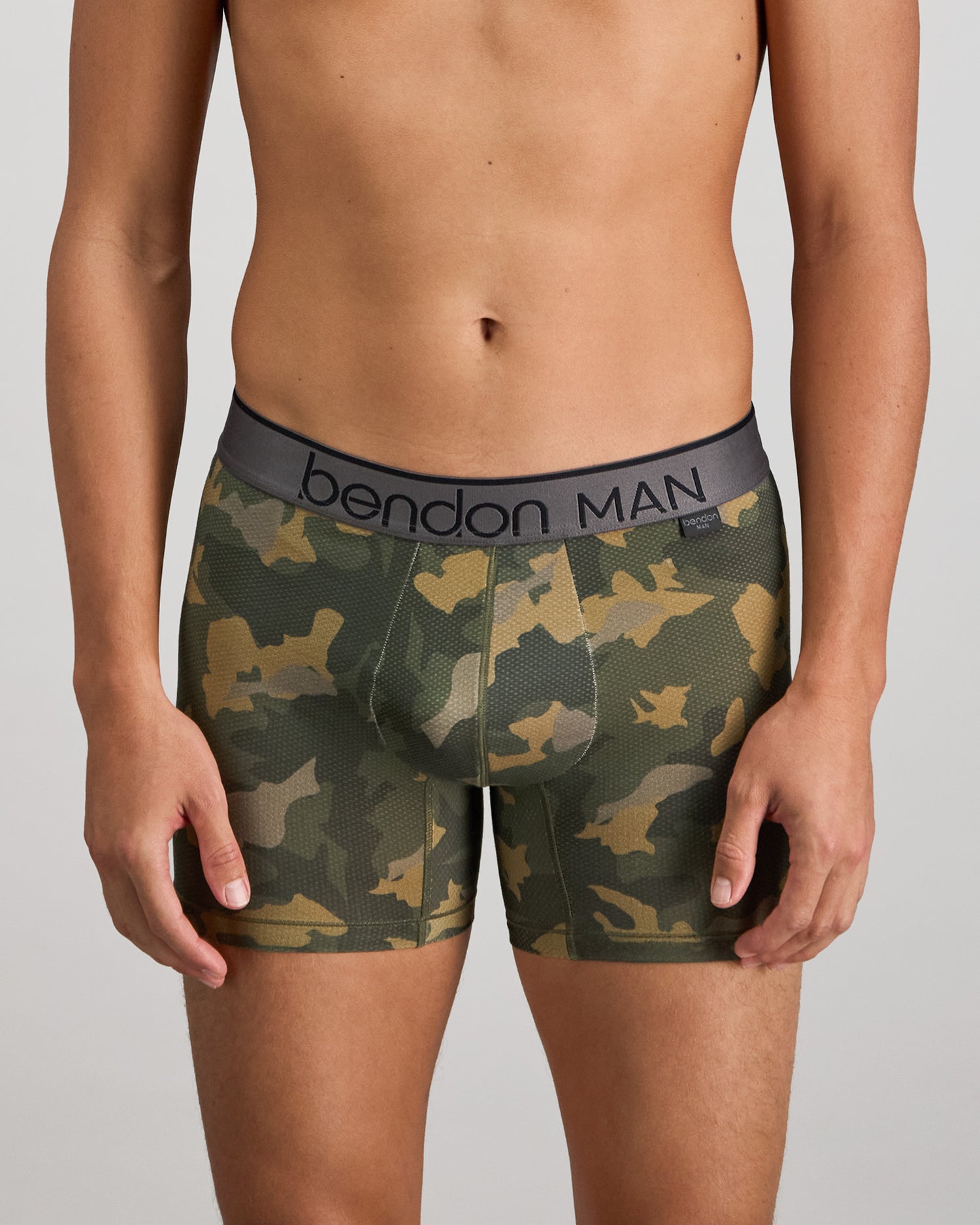 Model wears Everyday Active Mens Trunk in KOMBU CAMO. On body front view