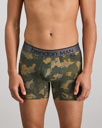 Model wears Everyday Active Mens Trunk in KOMBU CAMO. On body front view