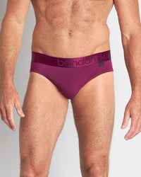 Model wears Bamboo Mens Brief in MAGENTA PURPLE. On body front view