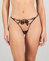 Model wears Niara Thong in BLACK. On body front view