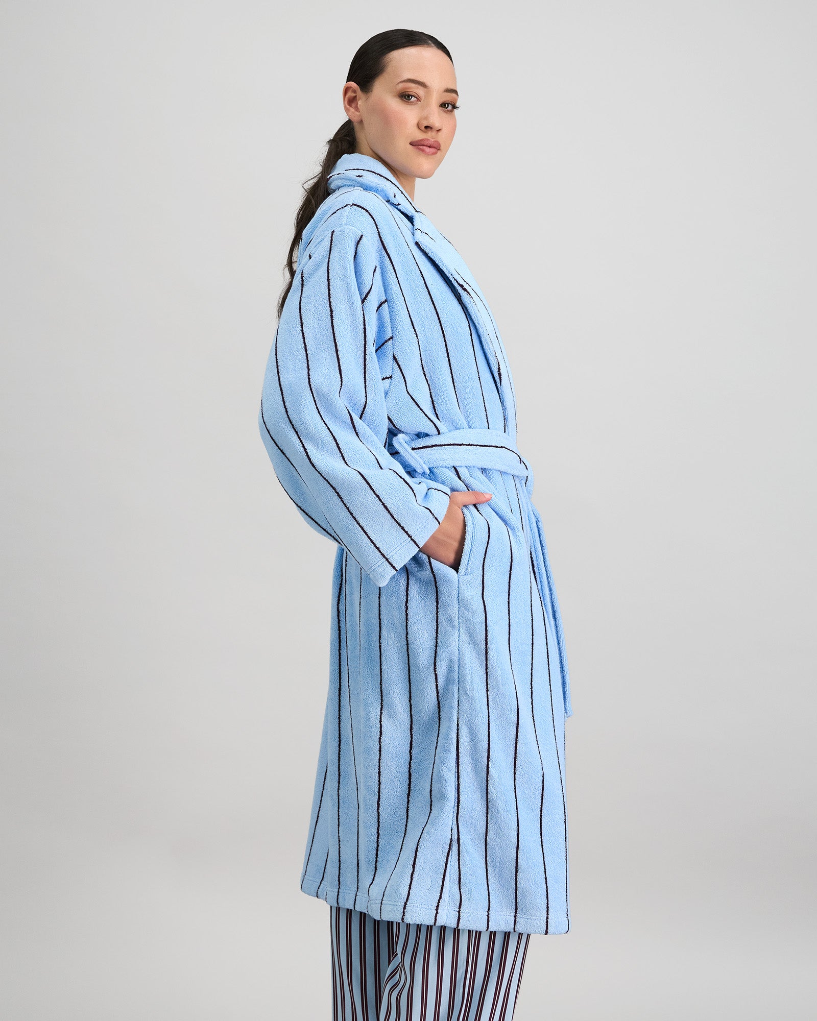Model wears Riviera Robe in COOL BLUE. On body side view