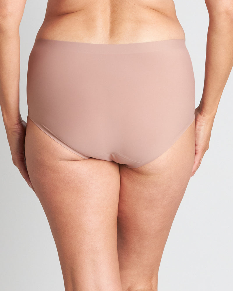 Model wears Flo Light Full Brief in MOCHA. On body back view