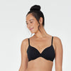 Model wears Body Cotton Contour Bra in BLACK. On body front view
