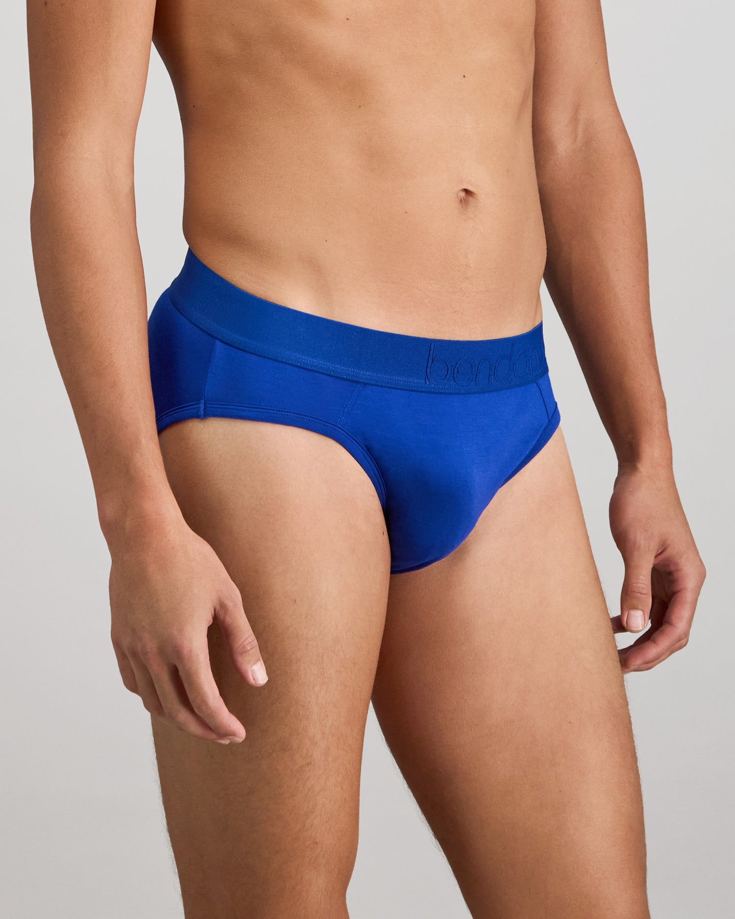 Model wears Bamboo Mens Brief in Surf The Web. On body side view