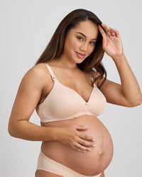 Model wears Bendon Nurture Maternity Bra in LATTE. On body side view