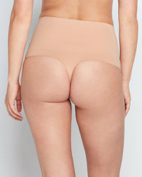 Model wears Bamboo Bodywear Thong in CARAMEL. On body back view