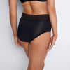 Model wears Flo Heavy Full Brief in BLACK. On body back view