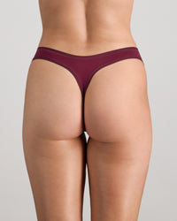 Model wears Extra-Ordinary Thong in FIG. On body back view