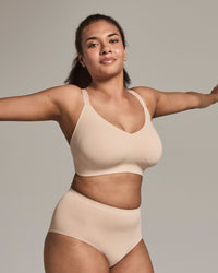 Model wears Comfit Collection Wire Free Bra in LATTE. On body side view
