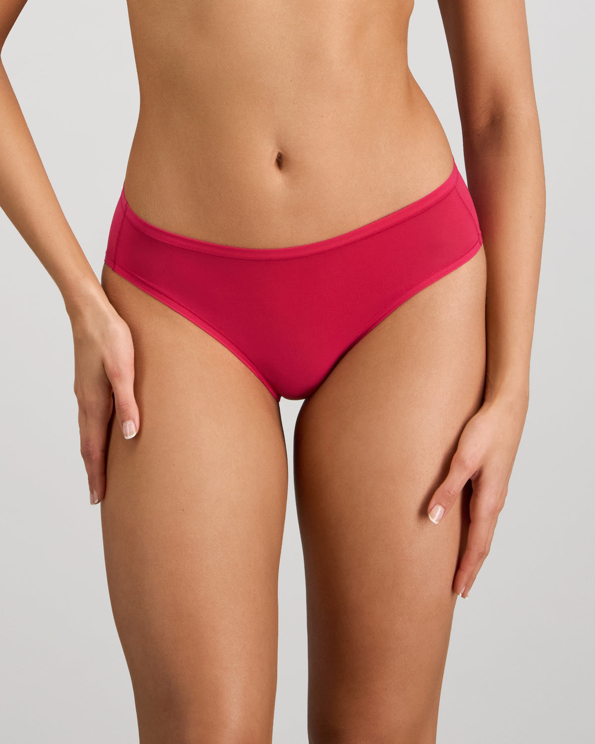 Model wears Extra-Ordinary Bikini in JAZZY. On body front view