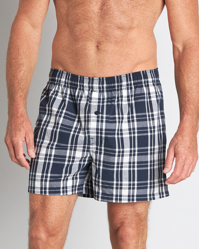 Model wears Lounge Boxer in BLUE WING TEAL CHECK. On body front view