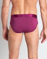 Model wears Bamboo Mens Brief in MAGENTA PURPLE. On body back view