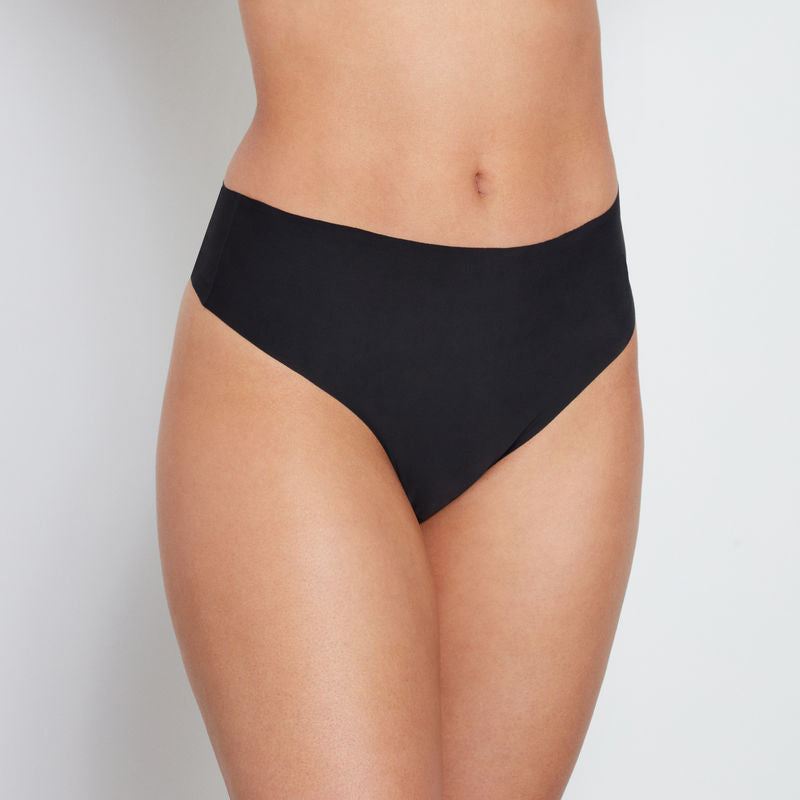 Model wears No Show Thong in BLACK. On body front view