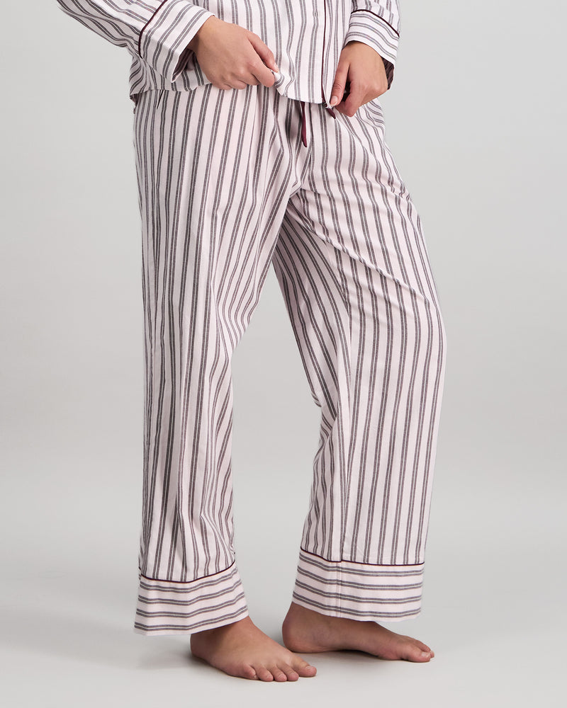 Model wears Cosy Flannel Long Pj Pant in PINK-A-BOO. On body side view