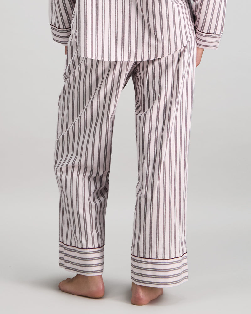 Model wears Cosy Flannel Long Pj Pant in PINK-A-BOO. On body back view