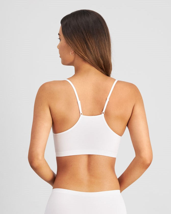 Model wears Simply Seamless Crop Top in WHITE. On body back view