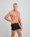 Model wears Cotton Texture Mens Trunk in BLACK. On body side view