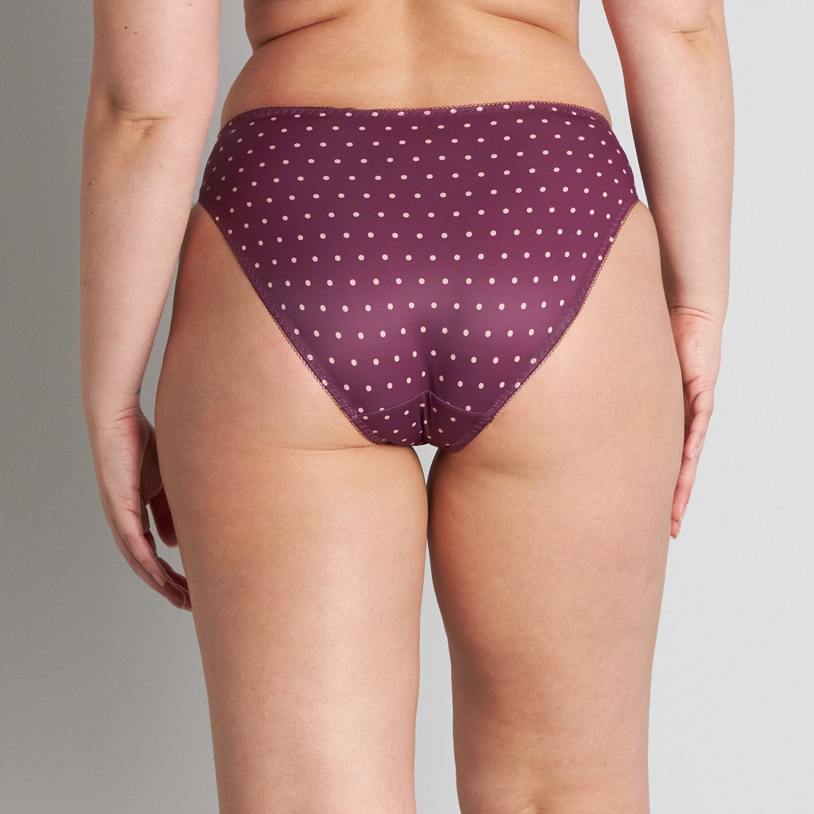 Model wears Rose Dot High Cut Brief in GRAPE WINE/ROSE CLOUD. On body back view